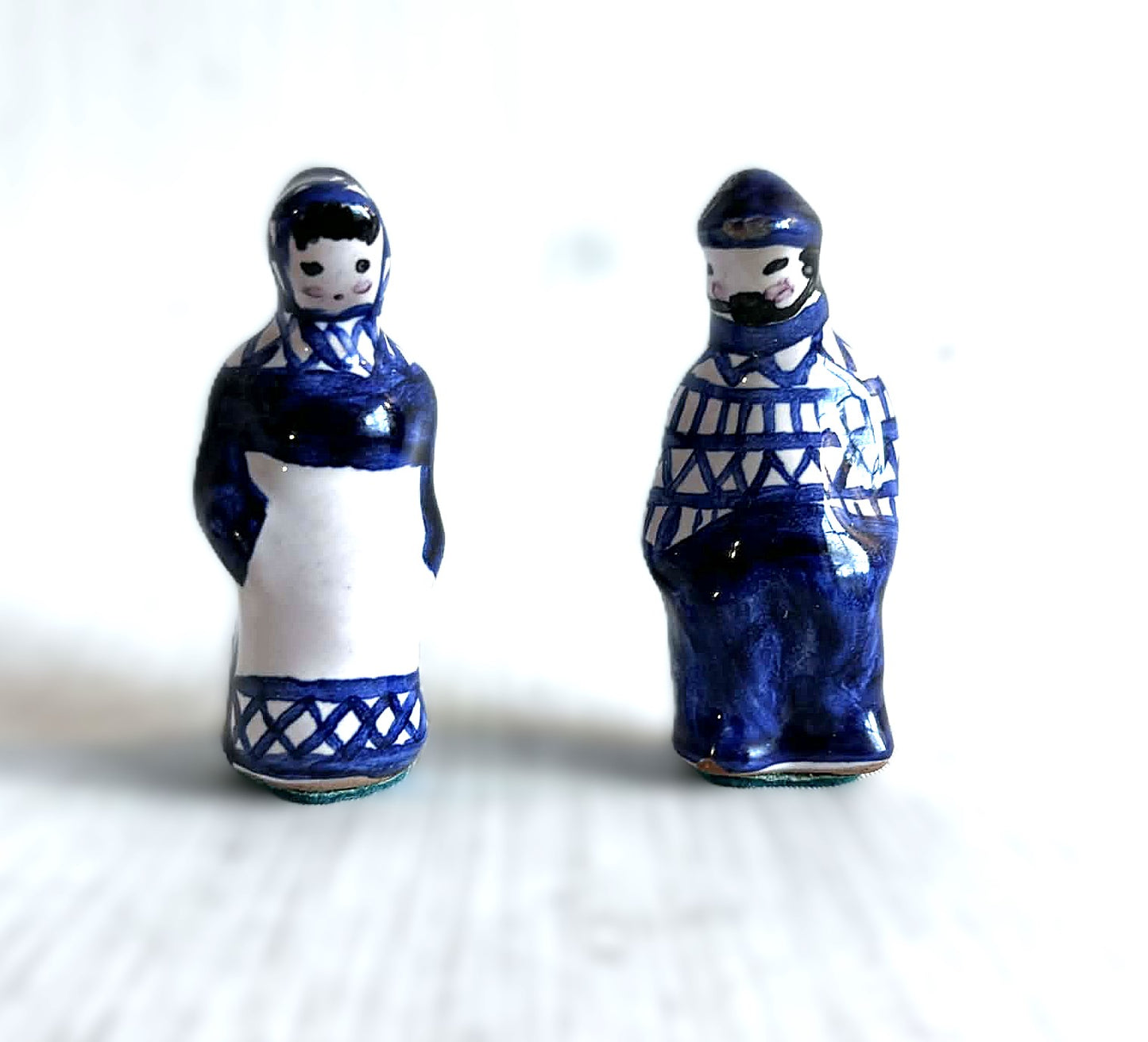 A pair of small handmade Gzhel ceramic figurines from the USSR