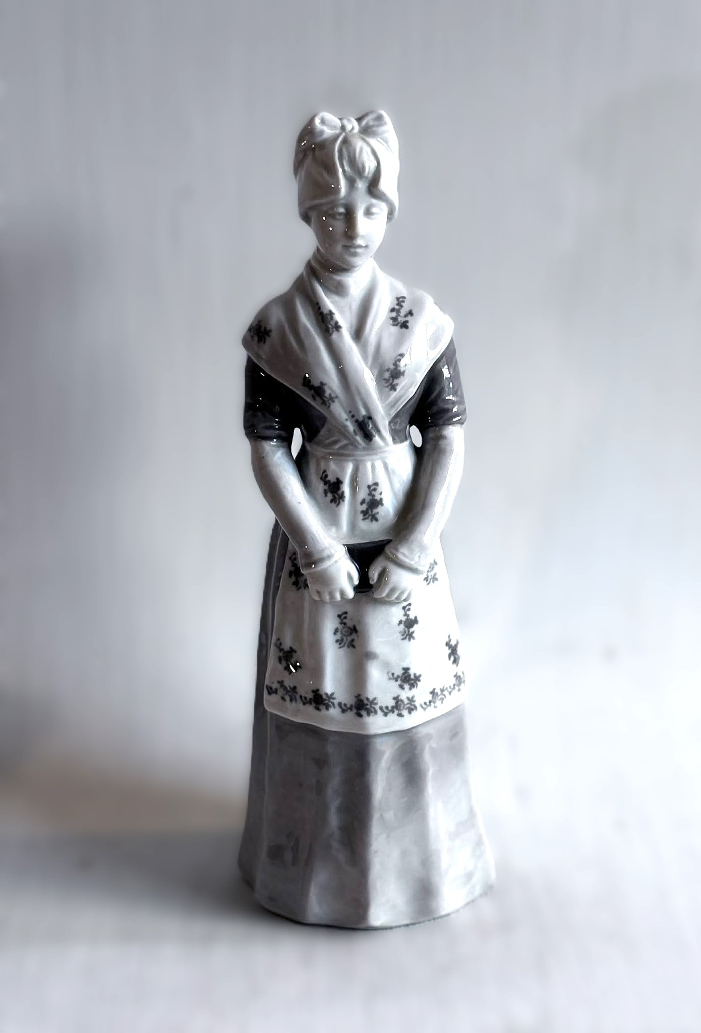 Heubach porcelain figurine of a young woman